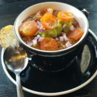 Spicy Vegan Chili (Green) · Green chili with quinoa topped with avocado, heirloom tomatoes & red onions. Spicy!