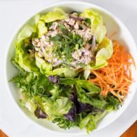 Larb Gai · Minced Chicken 'Larb' Salad with peanuts, herb roasted rice, chili flakes, lime

Please info...