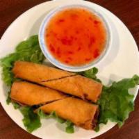 Egg Rolls / Cha Gio · Two crispy chicken egg rolls served with a sweet chili dipping sauce.