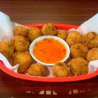 Fried Mushrooms / Nam Chien · Deep fried mushrooms served with dipping sauce.
