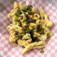 Salt And Pepper Squid / Muc Rang Muoi · Deep fried squid tossed in salt, green onions, and jalapenos.