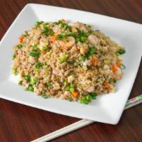 Fried Rice / Com Chien · Rice fried with eggs, peas, carrots, and green onions.
