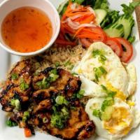 Grilled Rice Plate / Com Nuong, Bi, Trung · Meat marinated in lemongrass is grilled and served with rice, shredded pork skin, and a frie...
