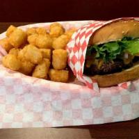 Cheeseburger · 1/2 lb patty* with your choice of American, Cheddar, or Swiss cheese with lettuce, tomato, o...