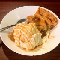 Apple Pie A La Mode · Delicious and hot apple pie served with a scoop of vanilla ice cream and a caramel drizzle a...