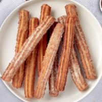 El Churro De Sabor · Three 10inch churros perfectly crisp, tossed in brown cinnamon sugar, and absolutely delicious