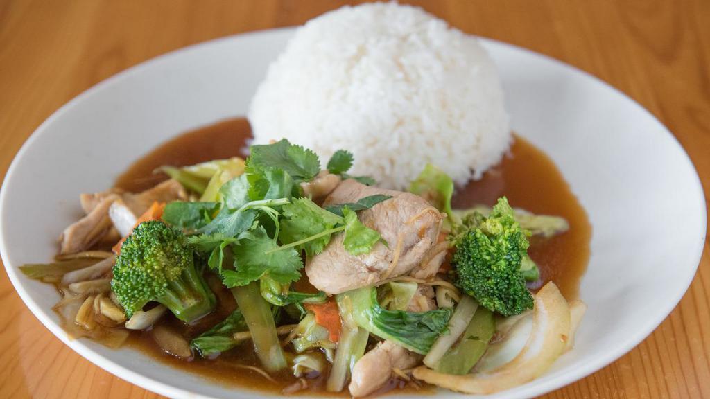 Ginger Chicken · Stir-fried chicken breast with mixed vegetables and ginger served with a side of steamed rice.