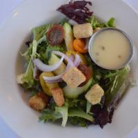 Side Garden Salad · Mixed greens, tomatoes, cucumbers, red onion, croutons, and house champagne vinaigrette