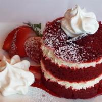 Decadent Red Velvet Cake · Red velvet cake layered with delicious cream cheese frosting topped with whipped cream