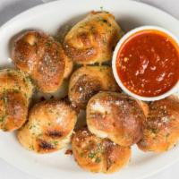 Garlic Knots · 8 pieces and comes with a side of marinara.