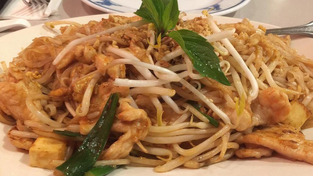 Phad Thai · Rice noodles, eggs, tofu, bean sprouts, green onions, and sprinkled on top with crushed peanuts.