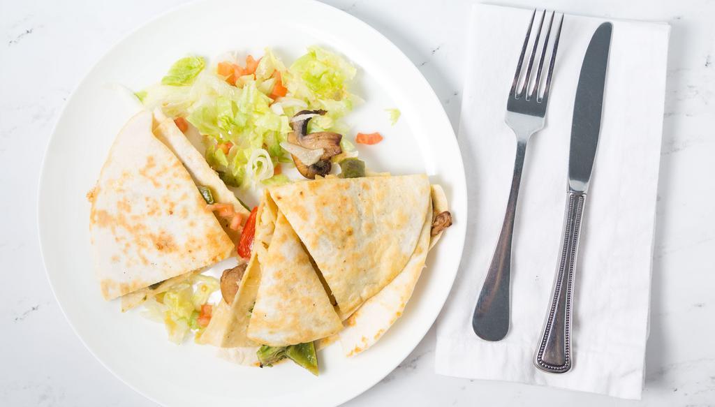Veggie Quesadilla · A flour tortilla with spinach, mixed vegetables and Jack cheese. Served with sour cream.