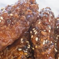 Bone-In Wings - 10 · Crispy and flavorful classic chicken wings with choice of 1 flavor-packed sauce.