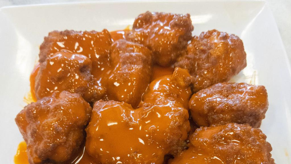 Boneless Wings - 10 · Crispy and flavorful classic chicken wings with choice of 1 flavor-packed sauce.