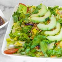 Large Garden Salad · Crisp salad with romaine lettuce, red cabbage, julienned carrots, sliced cucumbers and grape...