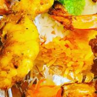 Lemongrass Shrimp Platter · lemongrass shrimp on skewer served with 1/2 white and 1/2 orange rice