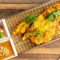 Thai Street Chicken Satay · Gluten free. Marinated with thai curry powder served with peanut sauce and fresh cucumber sa...