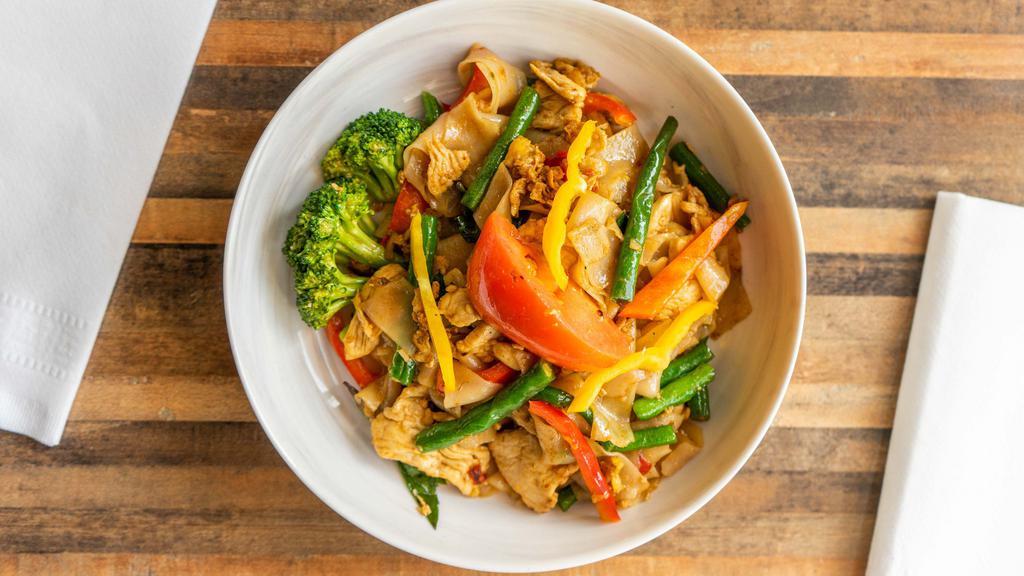 Pad See Moa · Spicy, gluten free. Flat rice noodles stir-fried with egg, tomatoes, broccoli, red bell peppers, green beans, basil, chili, and garlic.