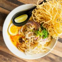 Khao Soi · Spicy. Noodles curry. Northern style noodles curry sauce, egg noodles, hard-boiled egg, bean...