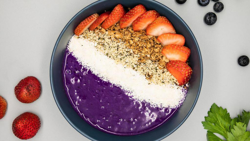 Moonrise Smoothie Bowl · 100% organic smoothie bowl made with blue majik, pitaya, strawberries, banana, cashew milk topped with granola, strawberries, coconut shreds & hemp seeds