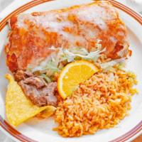 Steak Burrito Suizo · Rolled flour tortilla filled with steak, beans, and sour cream. Topped with tomato sauce and...