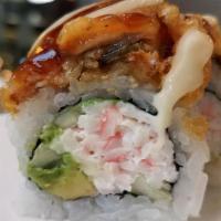 White Dragon Roll · Crab, cucumber, avocado, top with temp eel and sauces.