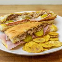 Cubano/The Cuban · Mojo Roasted Pork / Ham / Swiss / Mustard / pickles / Plantain chips.