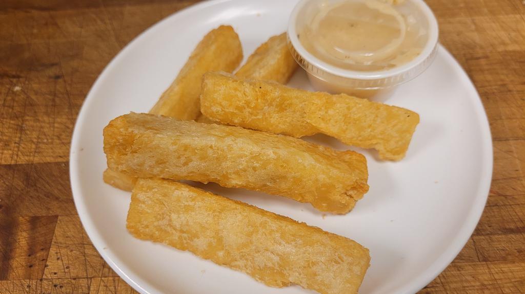Yuca Fries · Crispy and Delicious with Mojo Sauce