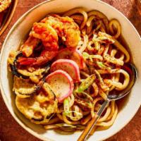 Shrimp Tempura Udon · Thick white noodles in fish broth soup with shrimp tempura.