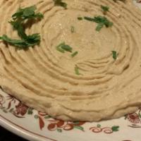 Hummus · Chickpeas, tahini, olive oil, and traditional spices. With naan