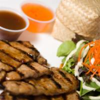 Bbq Pork · Slices of grilled pork tenderloin in a traditional Thai marinade, served with green salad, s...