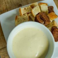 Fondue · Our legendary Rheinlander fondue, as craveable
and delicious as it was when it debuted in 19...