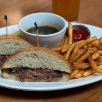 Prime Rib French Dip · Slow cooked prime rib, thinly sliced and served on a toasted ciabatta roll with homemade au ...