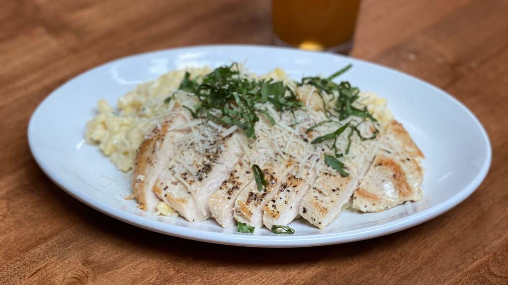 Spatzle Alfredo · Homemade spatzle tossed in alfredo sauce and chiffonade basil, topped with grilled chicken breast, roasted garlic and shaved parmesan.