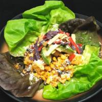 Lupita'S Salad · Romaine lettuce, spring mix, grilled corn, avocado, queso panela/cotija, tortilla 
chips wit...