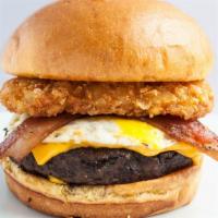 Morning Glory With Fries · Angus beef | bacon | fried egg |  hash brown patty | cheddar cheese on a toasted Brioche Bun