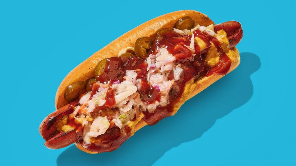 Vegan Sweet Carolina · Vegan dog topped with our house vegan cheese sauce, grilled onions & peppers, pickled jalapenos, our house vegan slaw, and sweet BBQ sauce.