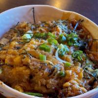 Katsu Donburi · Deep fried pork cutlet, eggs, cooked in sauce over rice.