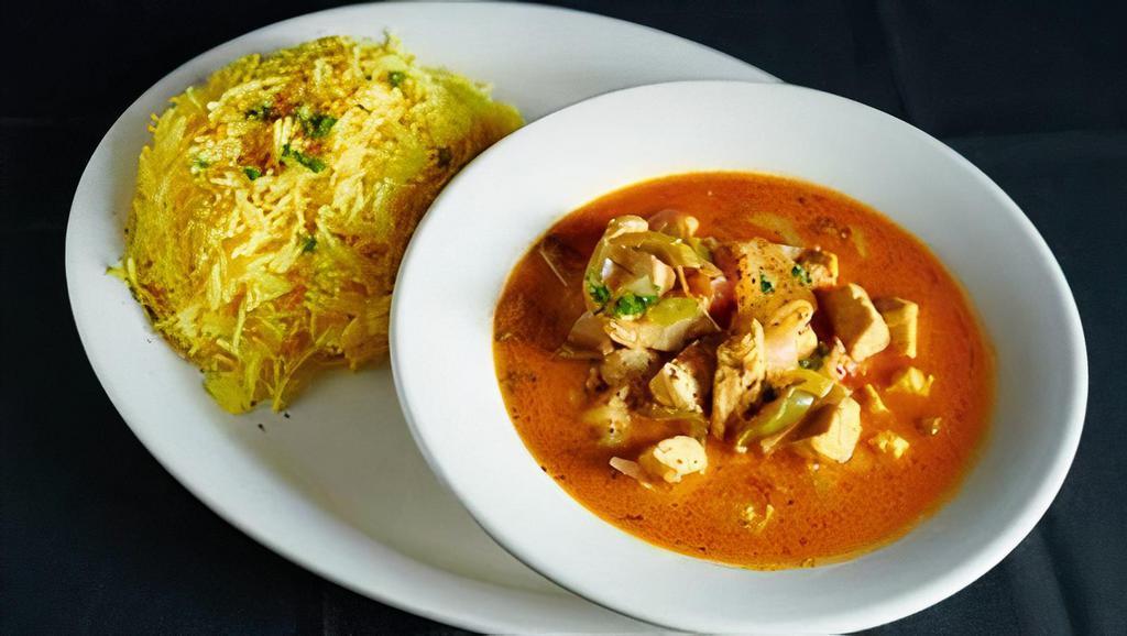 Chicken Curry · Chicken cubes cooked with a sauce, tomatoes, onions, and green bell peppers.