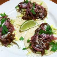 Tacos (3 Per Order) · Our House Smoked Chicken, Pork, or Brisket in Tinga Sauce With Napa, Pickled Red Onions, Cot...