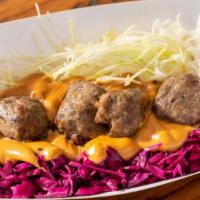 Norwegian Meatballs Wrap · Pork and beef meatballs in caramelized goat cheese gravy with pickled cabbage, wrapped in ou...