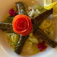 Grape Leave · 5 grape leaves stuffed with rice, tomatoes, parsley, lemon juice and a blend of spices.