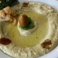Green Hummus. · Puree of chick peas, sesame sauce, lemon juice, garlic, and olive oil, served with two pitas.