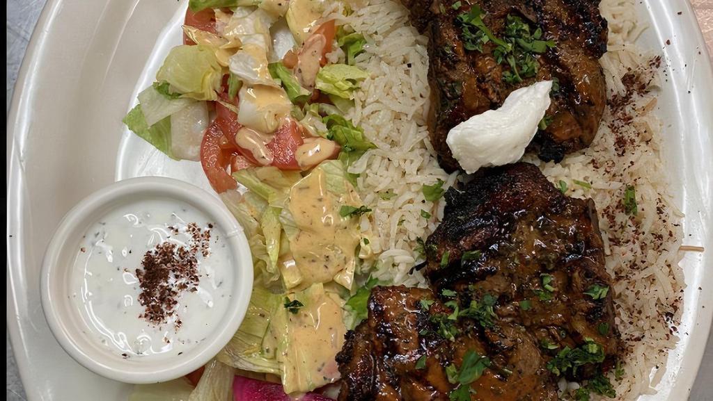 Lamb Chops · 4 Baby spring lamb chops, seasoned with special spices and broiled. Served with rice, house salad, garlic paste on top and two pitas.