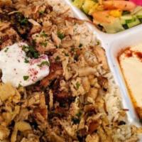 Chicken Shawarma · Marinated and seasoned chicken rotisserie broiled and thinly sliced.