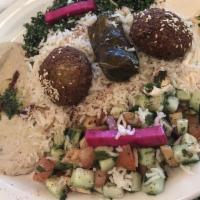 Vegetarian Combo · A combination of falafel, hummus, baba ghanouj, fattoush salad, grape leave and rice.