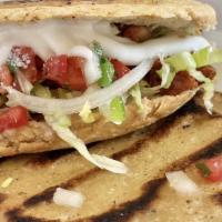 Gordita · Stuff with refried beans your meat choice lettuce pico de gallo sourcream an cotija cheese