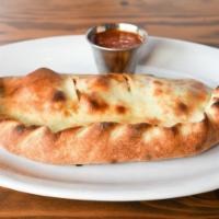 Italian Calzone · pepperoni, sliced meatballs, ricotta, portobello mushrooms, parmesan cheese, fresh mozzarell...