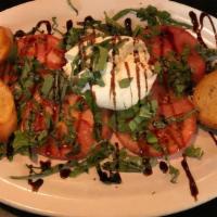 Buratta Salad · fresh burrata, sliced tomato, fresh basil, drizzled with balsamic reduction,. served with cr...