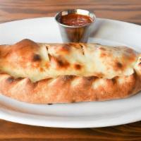 Hot & Spicy Calzone · meatballs, jalapenos, ricotta, roasted red pepper, garlic, fresh mozzarella and homemade sau...